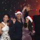 Friends having fun at a holiday party. Photo by Freepik.