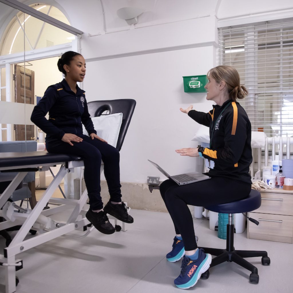 Erica Gethen Smith, Physical Health Lead, with a student. Photo by Rachel Cherry.